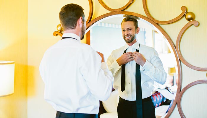 groom getting ready at kimpton Marlowe hotel
