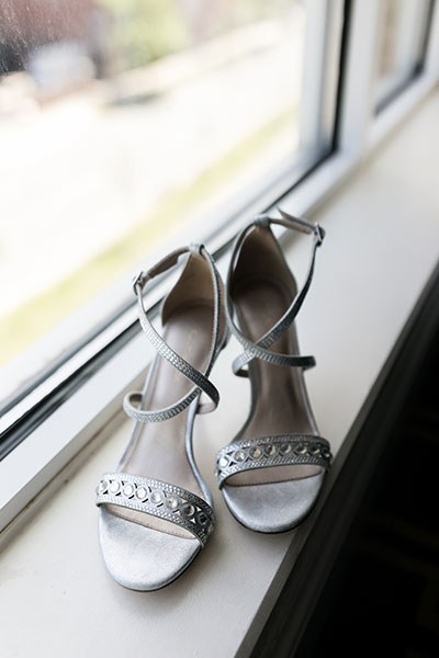 Brides wedding shoes by window