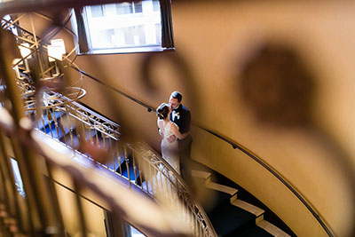 Wedding couple kissing on staircase