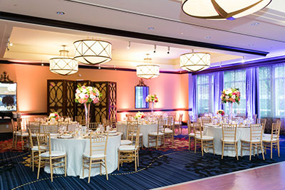 Wedding tables set up in ballroom