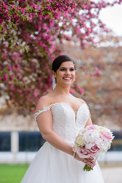 Bride standing by colorful florals