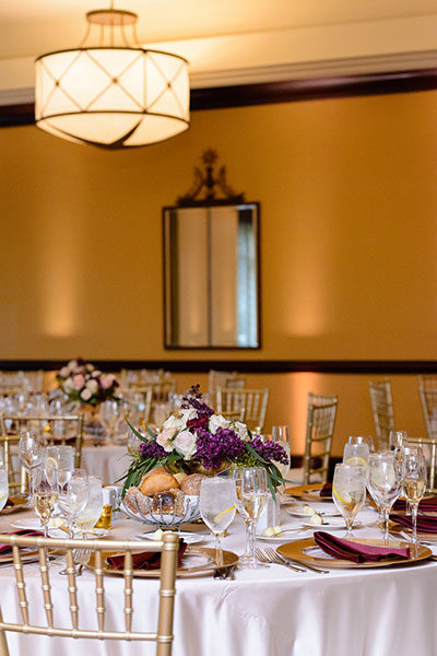 Wedding tables with centerpieces and floral arrangements 