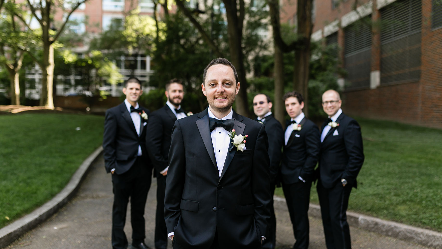 Groom in front of groomsmen