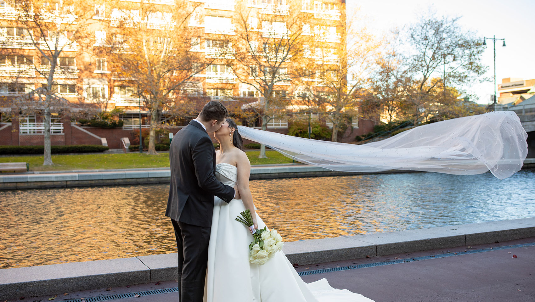 Bride and Groom on staircase in wedding attire