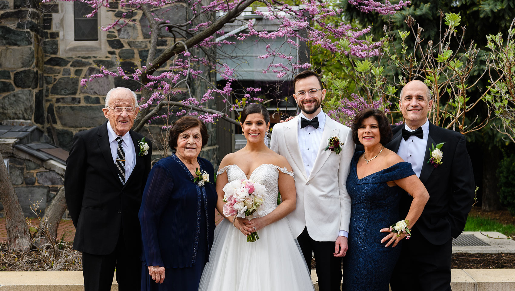 Bride and groom with family members 