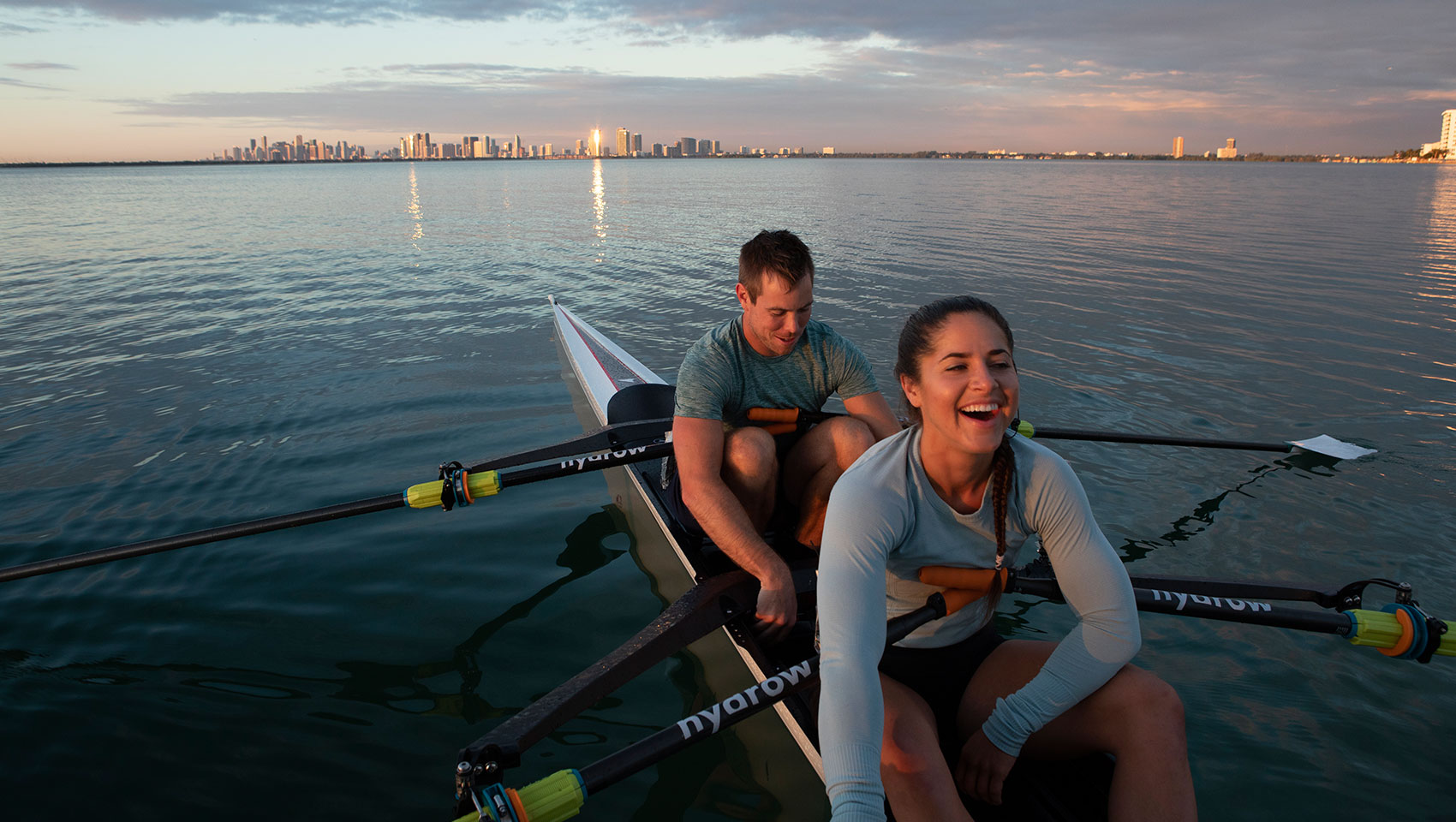 Couple Rowing on Lake