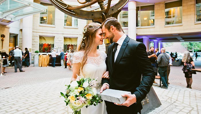 bride and groom next to the armillary