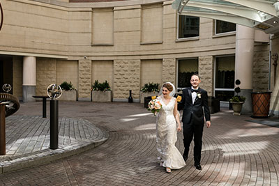 Wedding couple in hotel courtyard