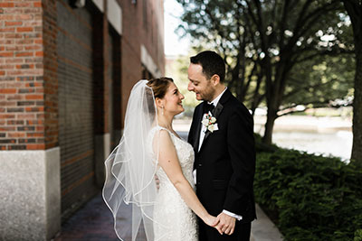 Wedding couple smiling at each other