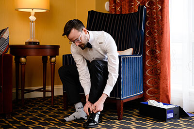 Groom adjusting socks