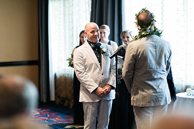 Grooms looking at each other 