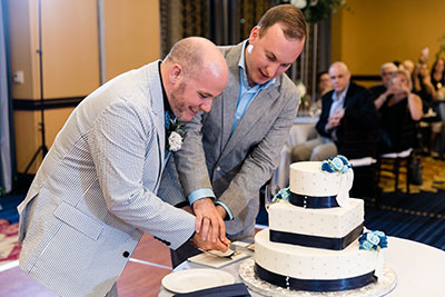 Grooms cutting cake