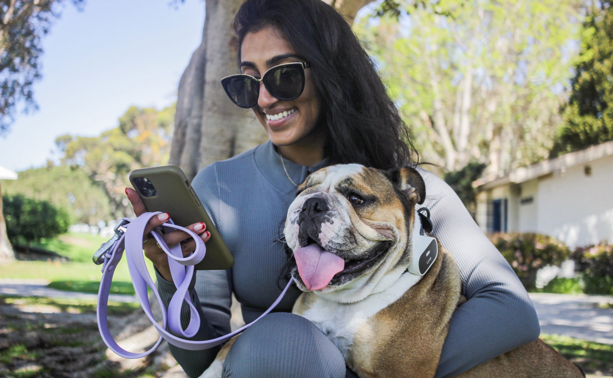 Woman with dog and phone