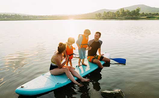 family on paddleboard