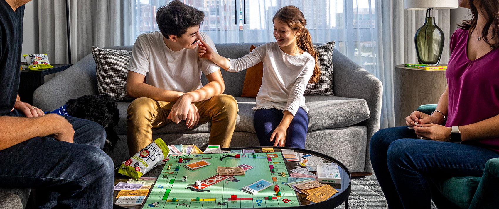 Family playing Monopoly 